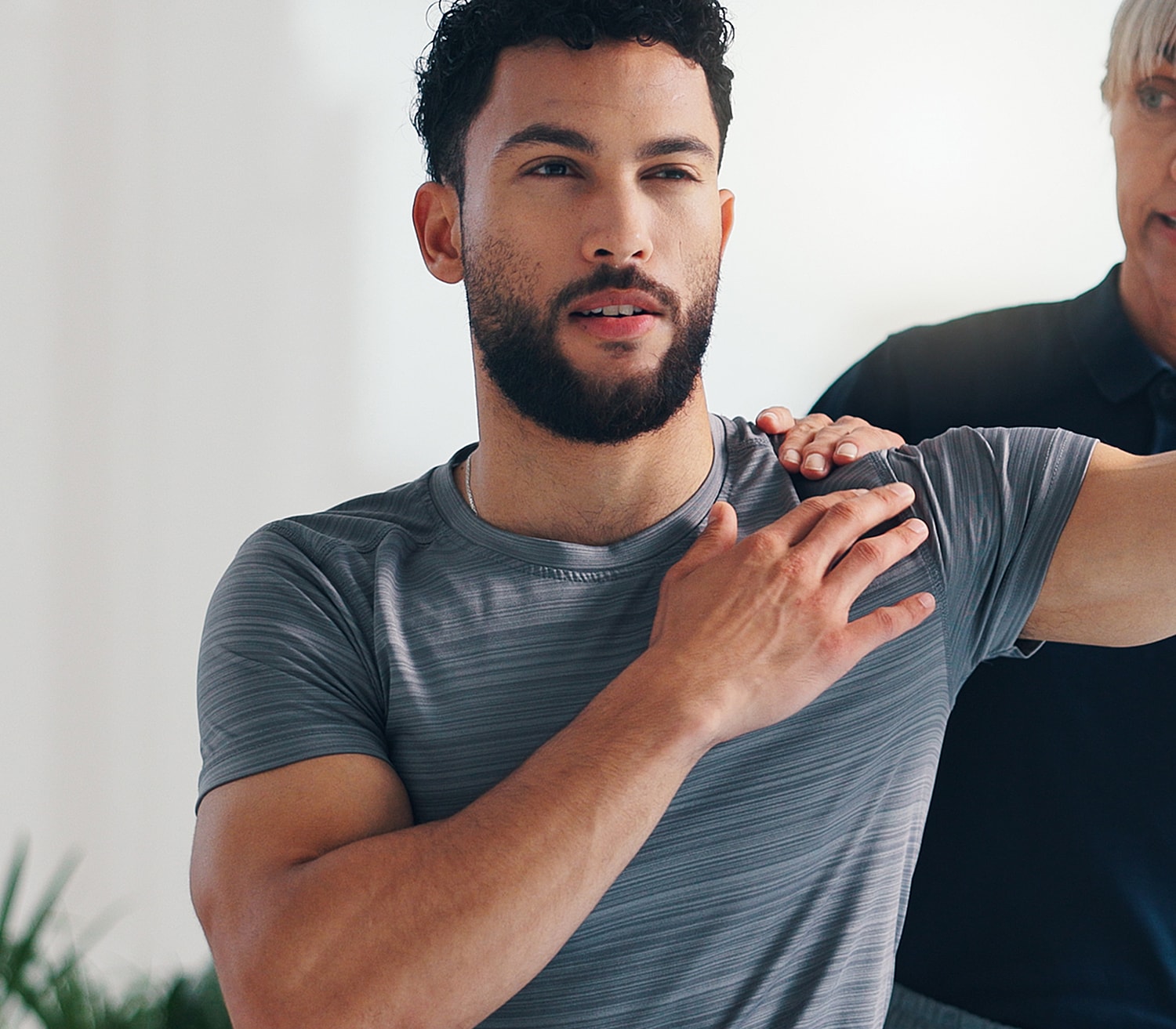 Physical therapy session focusing on shoulder movement.